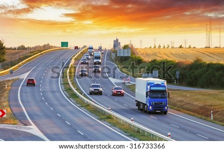 Highway transportation with cars and Truck Royalty-Free Stock Photo #316733366
