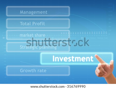 hand touching " INVESTMENT " sign on virtual screen