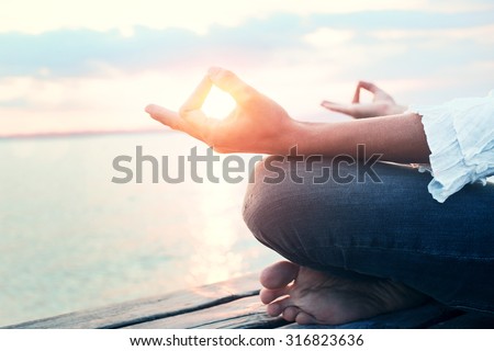 Peaceful woman finding body and mind balance Royalty-Free Stock Photo #316823636