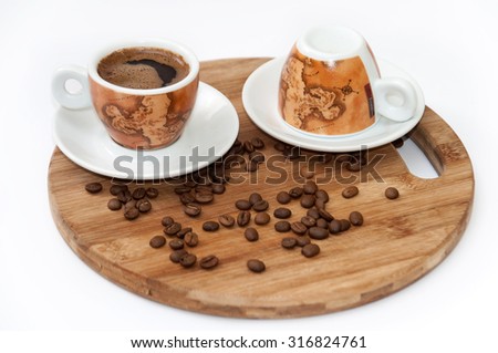Cup of coffee on the wooden board.