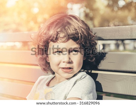 Portrait of adorable child in the park,selective focus