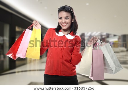 Asian woman holding shopping bag. Shopping sale concept