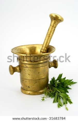 Antique mortar with aromatic herbs on white background. stock photo