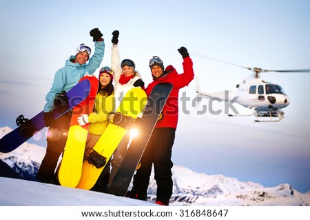 Snowboarders on Top of the Mountain with Heli Ski Concept Royalty-Free Stock Photo #316848647