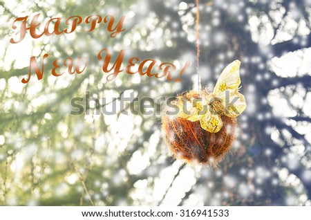 Christmas background with ball and butterfly decoration, Selective focus, blurred background, toned picture