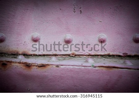 Metal pink background. Grunge background metal plate with screws