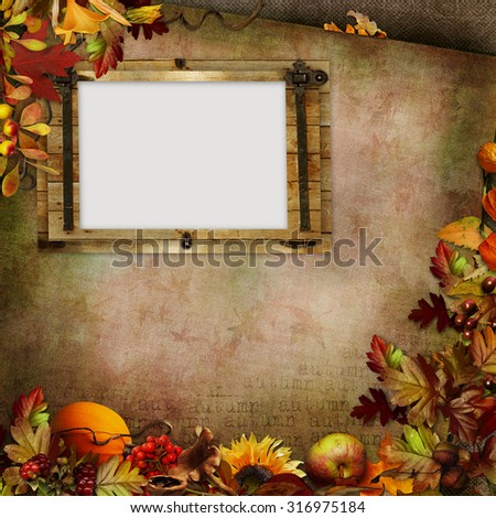 Border of autumn leaves, berries, vegetables and frame on a green vintage background