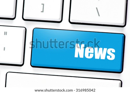 Computer white keyboard with news 