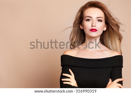 Beautiful young woman with long hair and jewelery. Royalty-Free Stock Photo #316990319