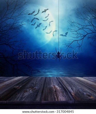 Wooden floor with spider and spooky Halloween background