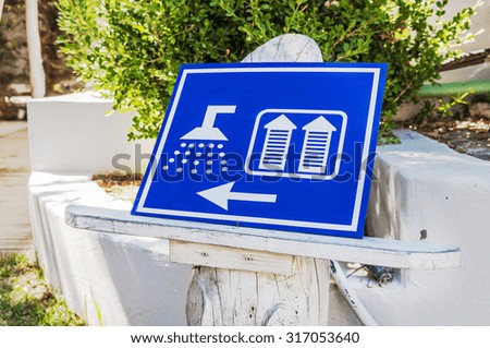 Blue sign of public toilets WC shower for women and man