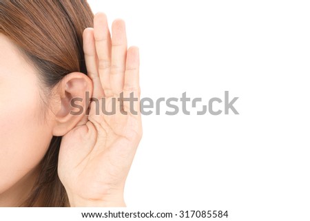 Asian woman hold her hand near her ear and listening Royalty-Free Stock Photo #317085584