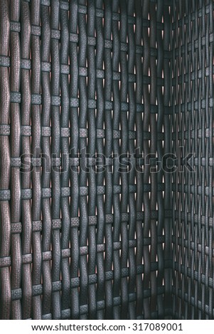 Dark modern and contemporary beautiful brown plastic weave fabric pattern or texture suitable for backgrounds or website wallpaper