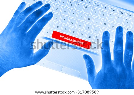 Hands on laptop with "PROGRAMMING" word on spacebar button on white background.