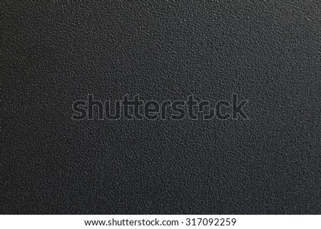 Black plastic material seamless background and texture Royalty-Free Stock Photo #317092259