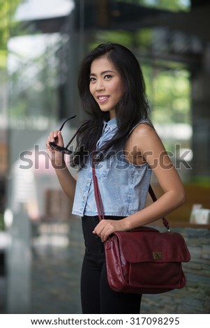 Portrait of businesswoman standing outdoor in a modern city
