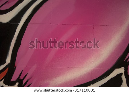 Pink, white and black stripes on the wall. Graffiti.