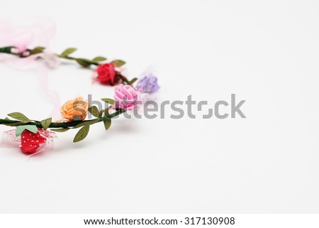 Head band with colourful flower isolated on white background