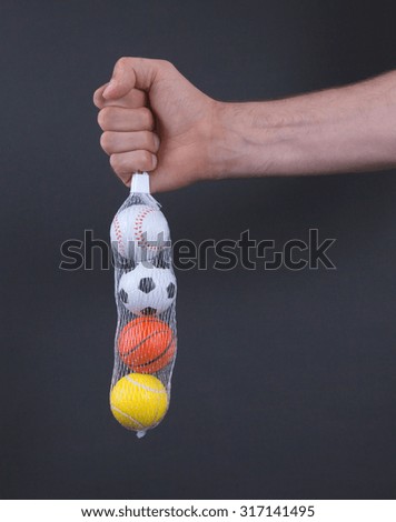 Small toy balls isolated on black background