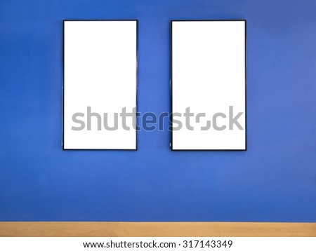 Mock up poster Blank frame on Blue wall 