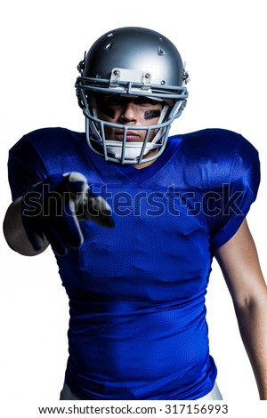 American football player pointing against white background