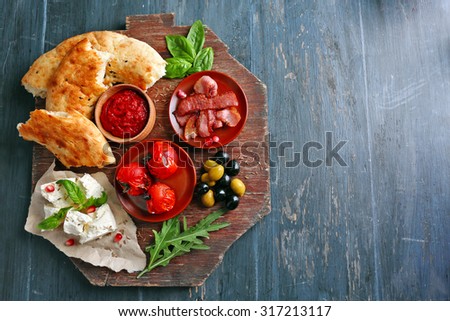 Ingredients of Mediterranean cuisine, on wooden board, top view