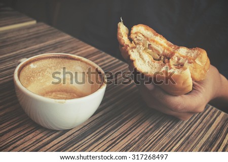 Hamburger with coffee cup