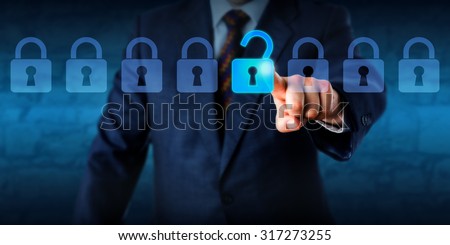 Manager is unlocking a virtual lock in a lineup of eight padlocks. Business concept and technology metaphor for cyber attack, computer crime, information security and data encryption. Copy space. Royalty-Free Stock Photo #317273255