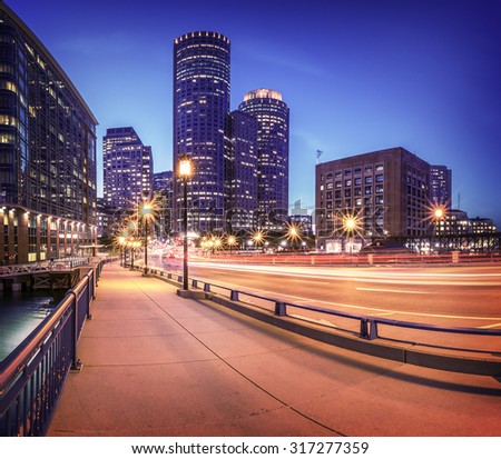 Panoramic view of Boston in Massachusetts, USA at night showcasing its mix of modern and historic architecture.