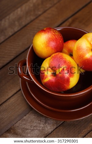 top view of peaches on a wooden background