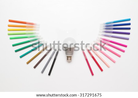 light bulb with wings created from magic pens, meaning about idea can create anytime easily, idea also can fly away. white background.