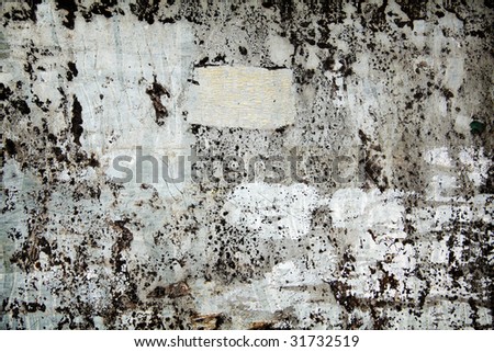 abstract grunge background with paint and paper on metal