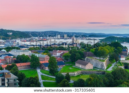 Oslo, Norway. A view at Oslofjord and Akershus fortress from the top of City hall (Radhuset) tower. Taken on 2015/09/11 Royalty-Free Stock Photo #317335601