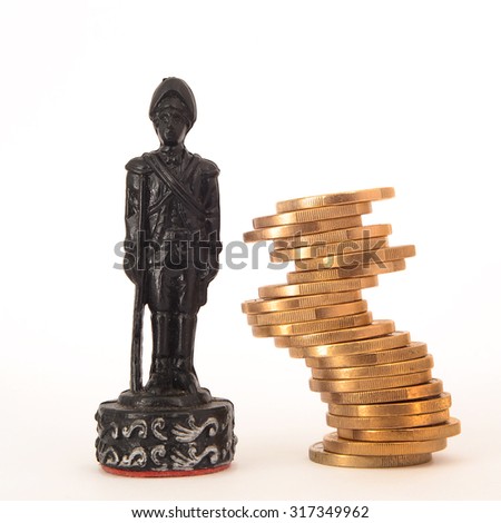 chess figure and column of euro coin