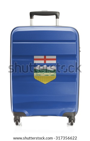 Suitcase painted into Canadian territory or province flag series - Alberta
