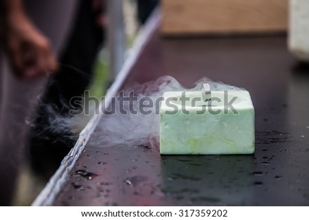 Demonstration of Superconductivity, Special Material Cooled with Liquid Nitrogen Royalty-Free Stock Photo #317359202
