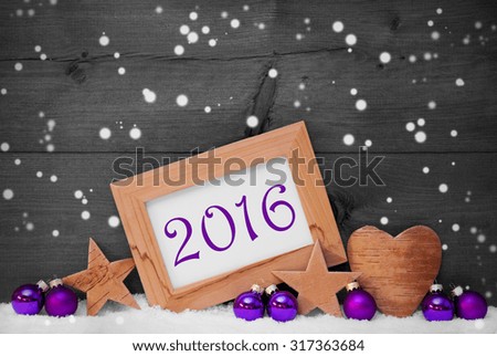 Black and White Christmas Card With Purple Christmas Decoration On White Snow, Snowflakes. Picture Frame With Text 2016, Star, Heart And Christmas Tree Ball. Rustic Brown Wooden Background