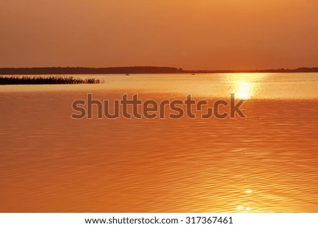 Golden sunset over the lake