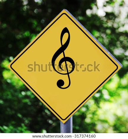 Yellow traffic label with violin clef pictogram