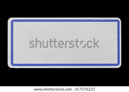 Blank Paper Tag or Label with Blue Border isolated on Black Background. Sticker or Paper Adhesive with Wrinkles and Scratches. Close Up. Top View with Copy Space for Text or Image