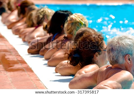 people doing water aerobics in a pool