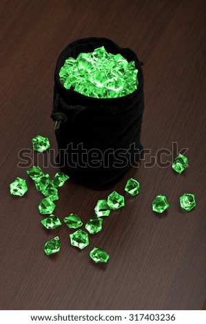 Bag of emeralds Royalty-Free Stock Photo #317403236