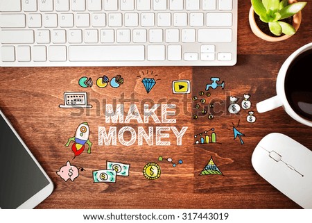 Make Money concept with workstation on a wooden desk 
