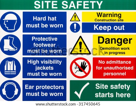 Brightly colored building site safety warning signs