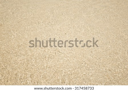 Golden brown sand of beach texture background