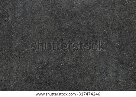 Real asphalt texture background. Coloured dark black asphalt pattern. Grainy street detail gray textured background. Best way show your design or illustration with this actual asphault photo texture.