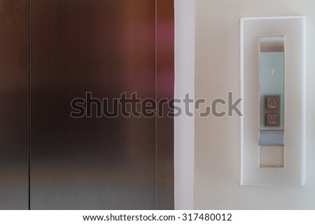 elevator button up and down, modern metal elevator close door in building office