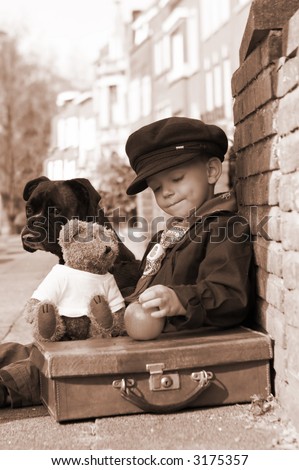Vintage photo of a little boy and his dog Royalty-Free Stock Photo #3175357
