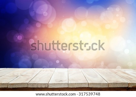 Empty top wooden table and blur with bokeh background. For product display