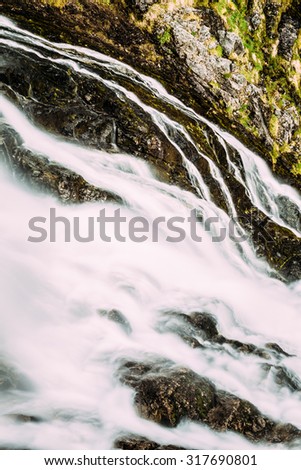 Waterfall in Norwegian mountains. Norway, Nature of Naeroyfjord.